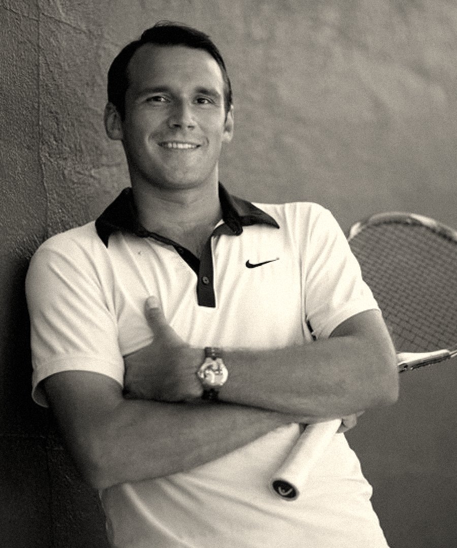 Kirill Azovtsev with a tennis racket on court